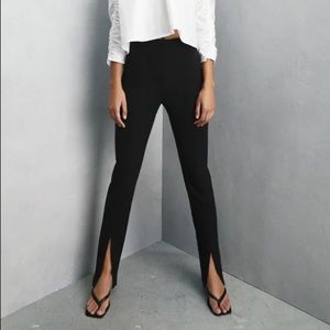 Black Zara pants with flare at the bottom.